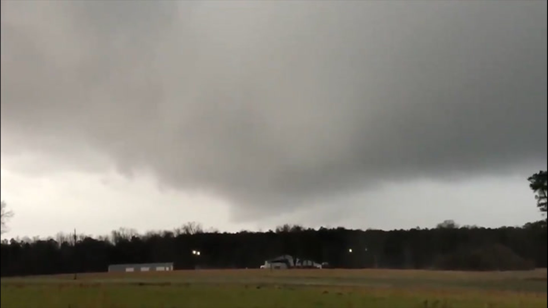 A meteorology student posted a video on social media of a rotating wall cloud and possible funnel cloud on Christmas Eve near Princeton, North Carolina.