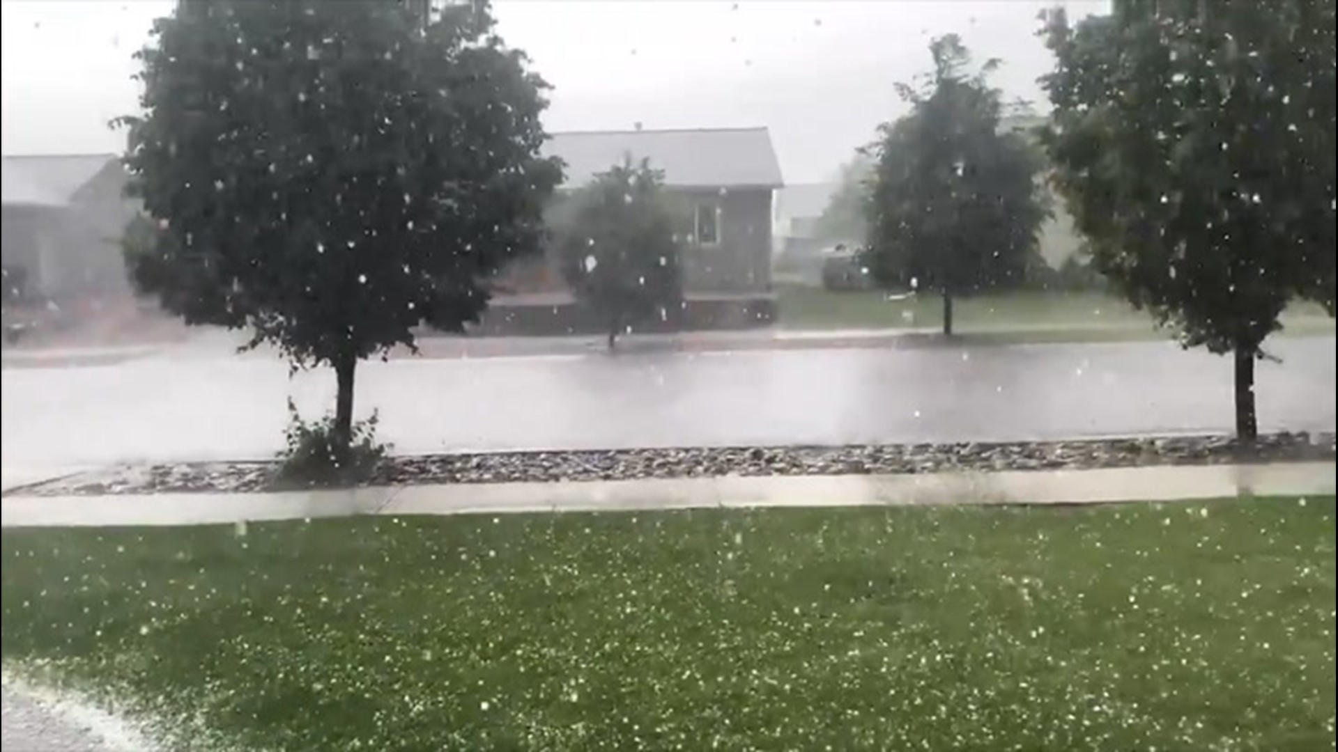 On Wednesday, June 24, a hail storm passed through Kalispell, Montana, covering the ground in icy pellets.