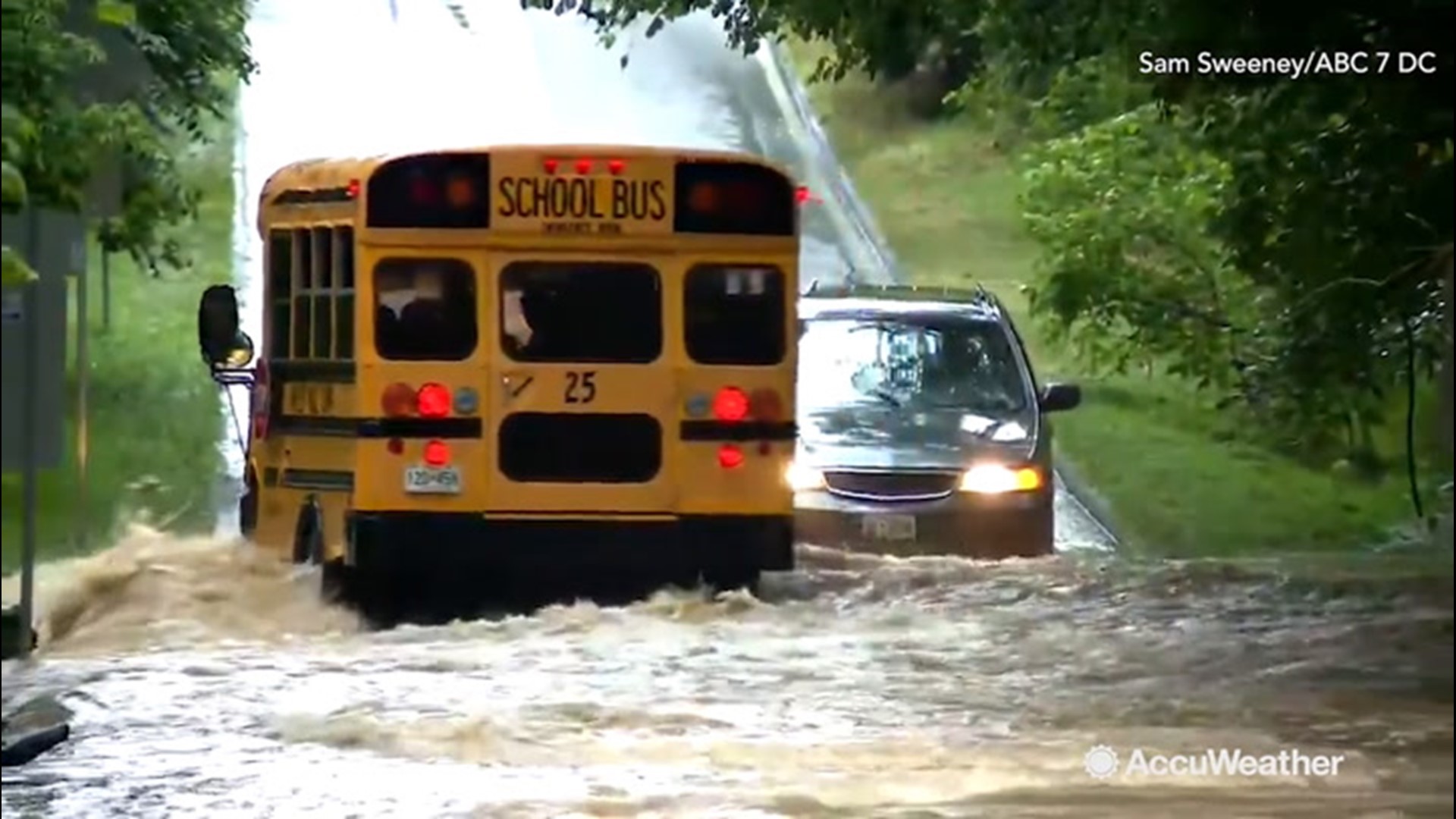 A school bus with children on board drove through a flooded road on Monday, July 8, 2019 in Montgomery County, Maryland.