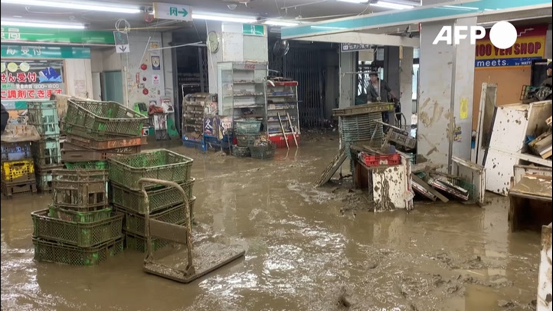 Workers cleaned up a supermarket in Hitoyoshi, Japan, on July 9, after deadly flooding swept through the city, leaving mud throughout the building.