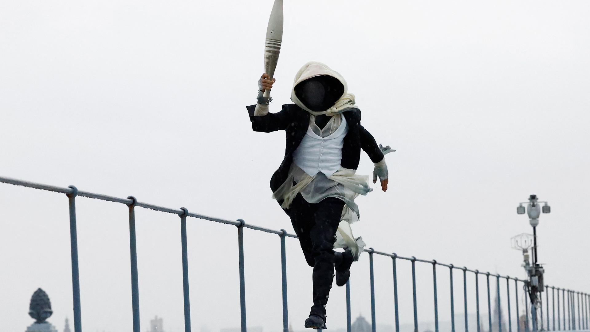 The Paris Opening Ceremony heavily featured a mysterious character who took off with the Olympic torch and left viewers trying to figure out who they are.