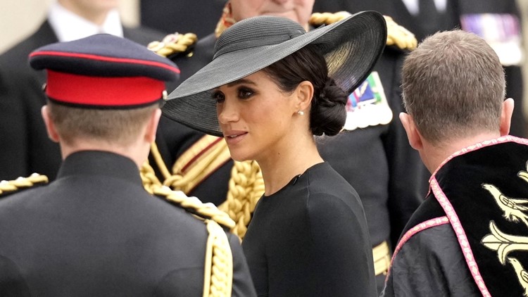 Meghan Markle smiles at Princess Charlotte during Queen's funeral