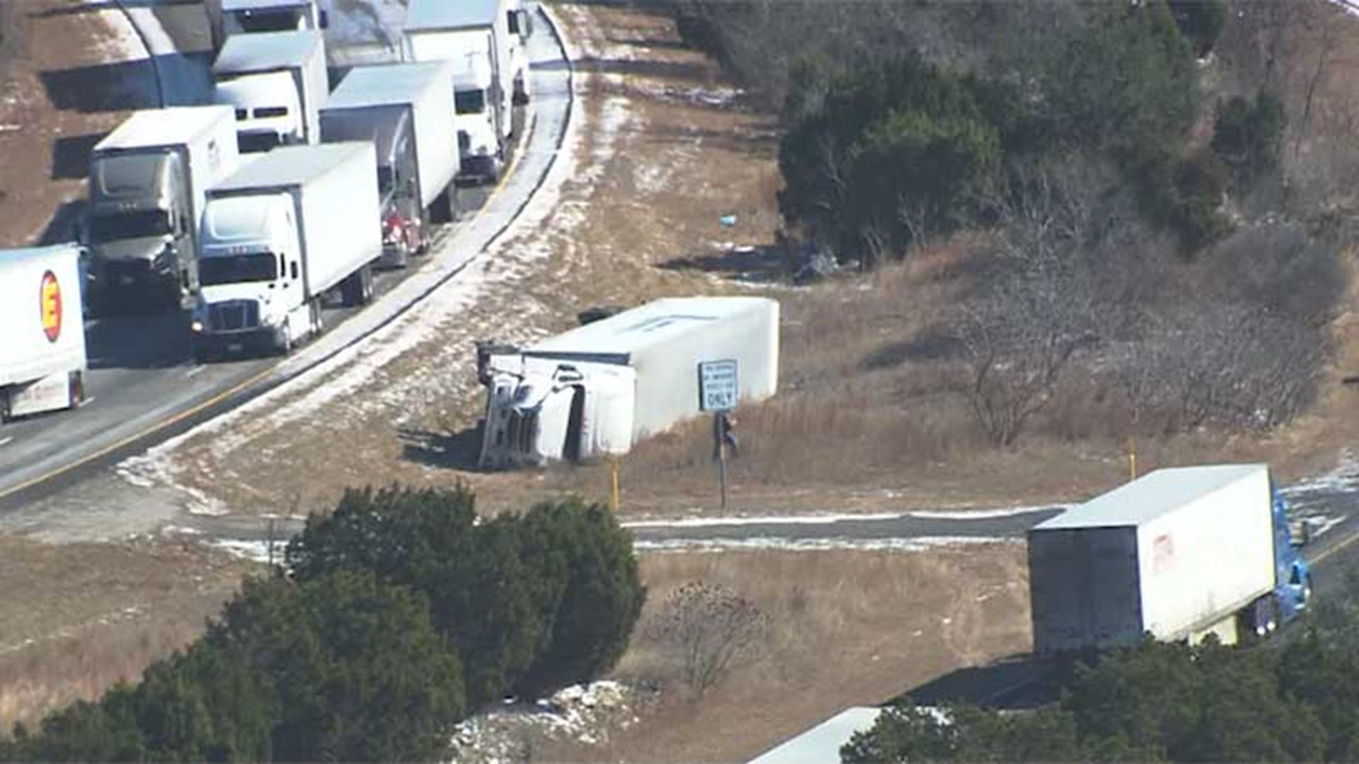 Miles of trucks and cars were stuck for hours on Interstate 10 near Kerrville after a couple of crashes blocked the highway in icy conditions.