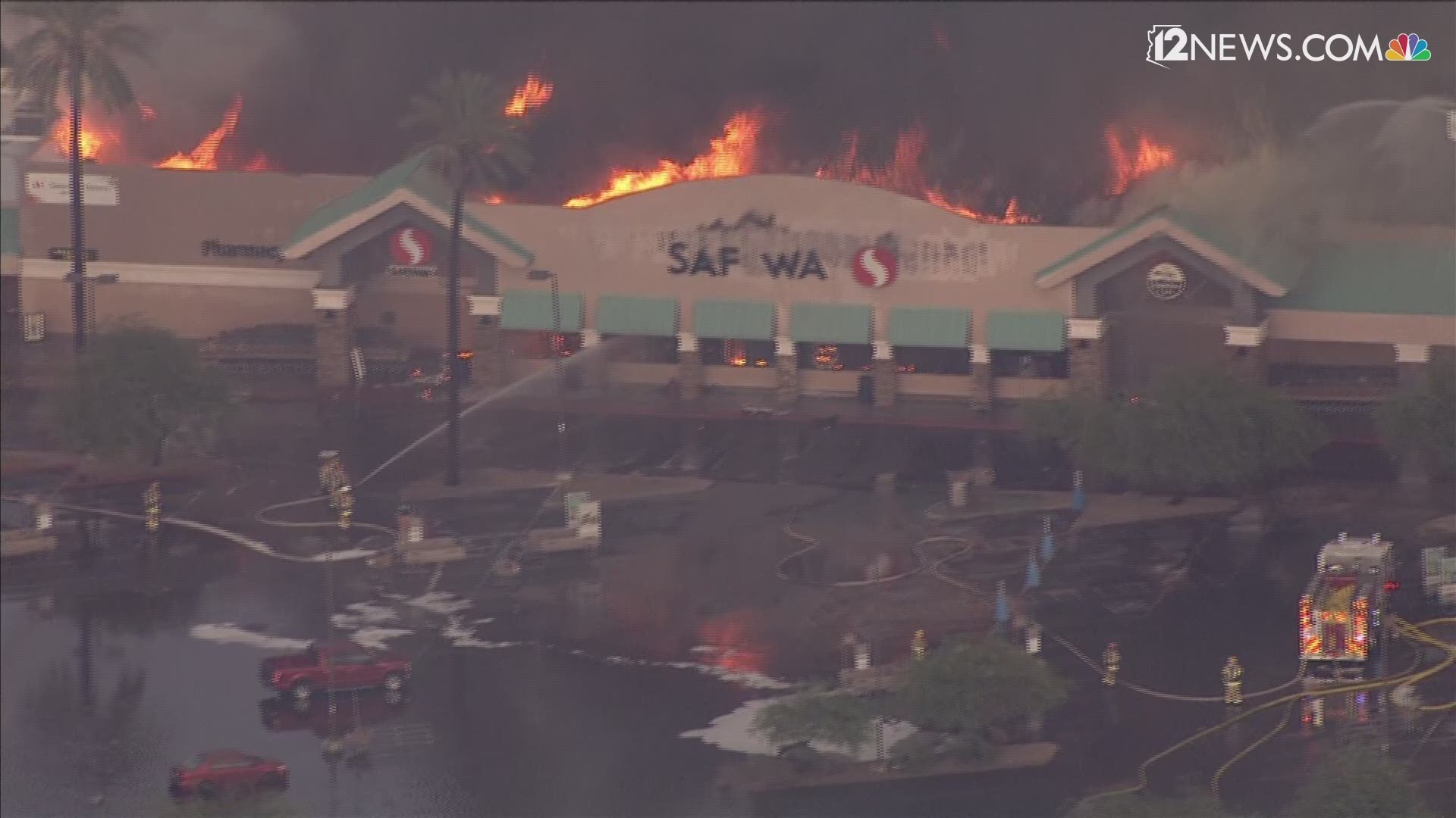 A fire has engulfed a north Phoenix Safeway. Watch as the front melts off and then collapses.