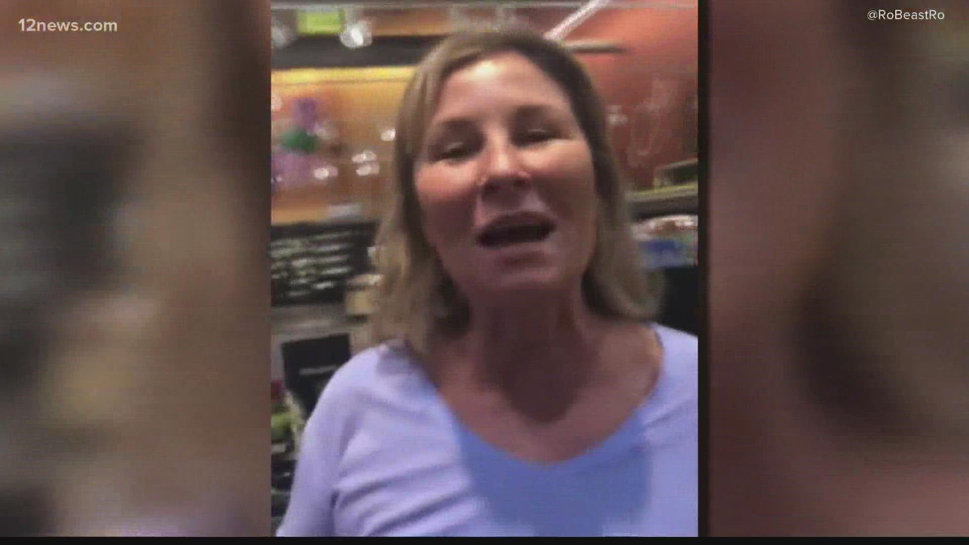 A Scottsdale woman was caught on camera intentionally coughing at customers at a grocery store.