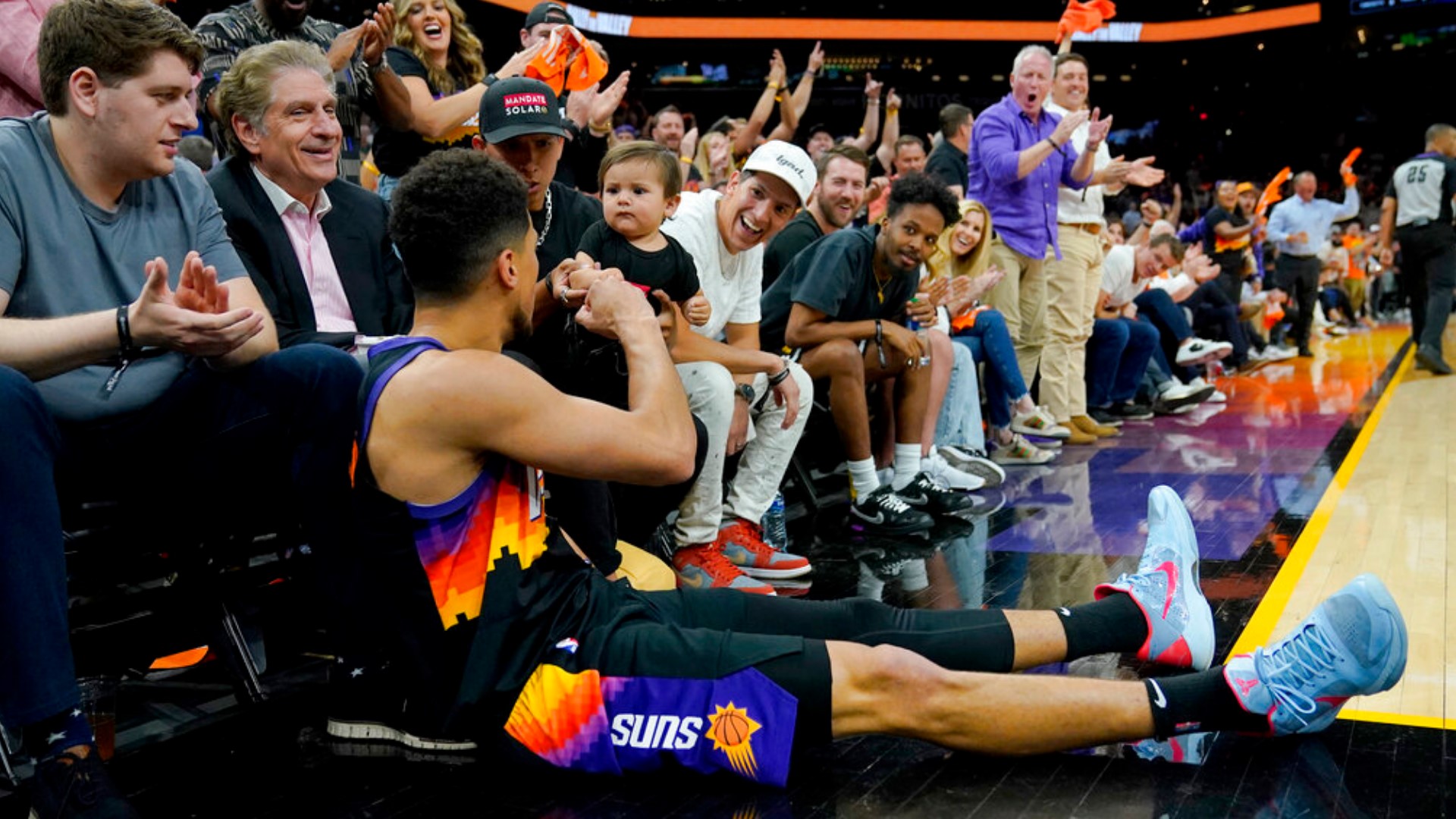 Say hi to Ozzy. He's the baby who dapped Devin Booker after a tough shot in Game 2 of the NBA Playoffs against the New Orleans Pelicans.