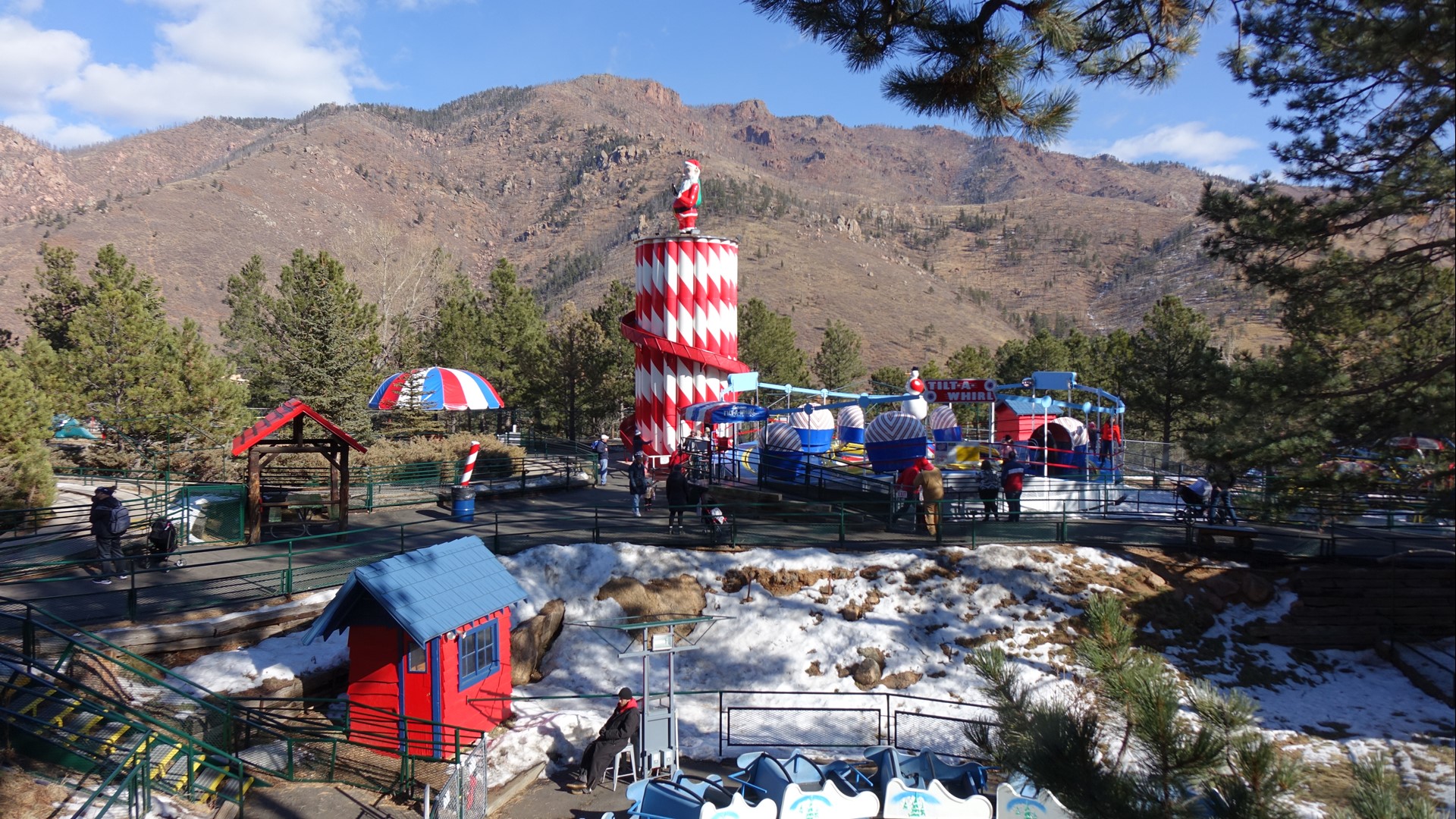 Peeking above the trees at the base of Pikes Peak is a Christmas-themed amusement park and village that has been attracting families for more than 60 years.