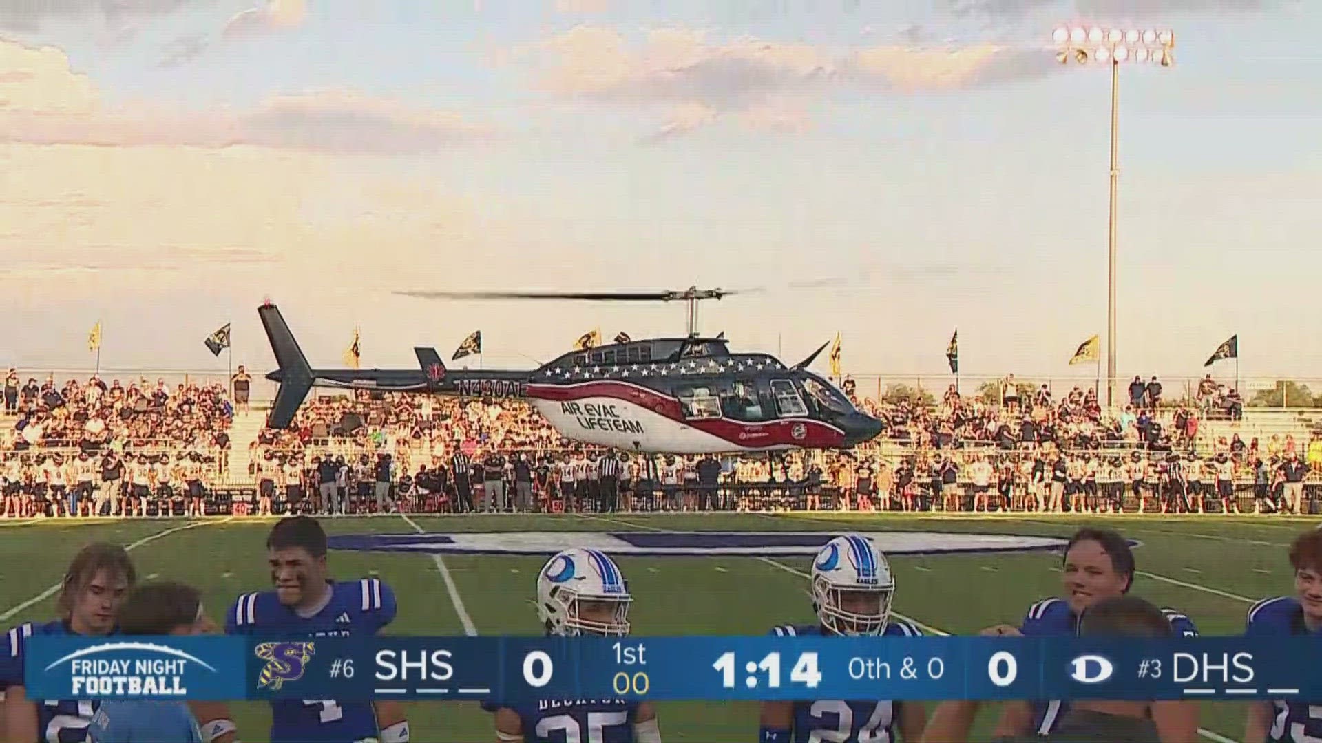 The showdown between the two ranked high school football teams had a unique opening as a helicopter descended upon the field to deliver the game ball.