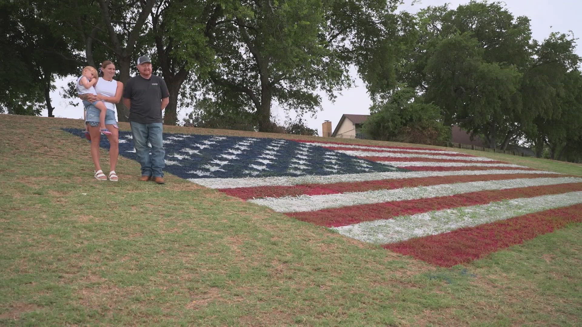 Colin Wright and his daughter painted a 55x29-foot U.S. flag on a Grand Prairie field, visible from I-30.
