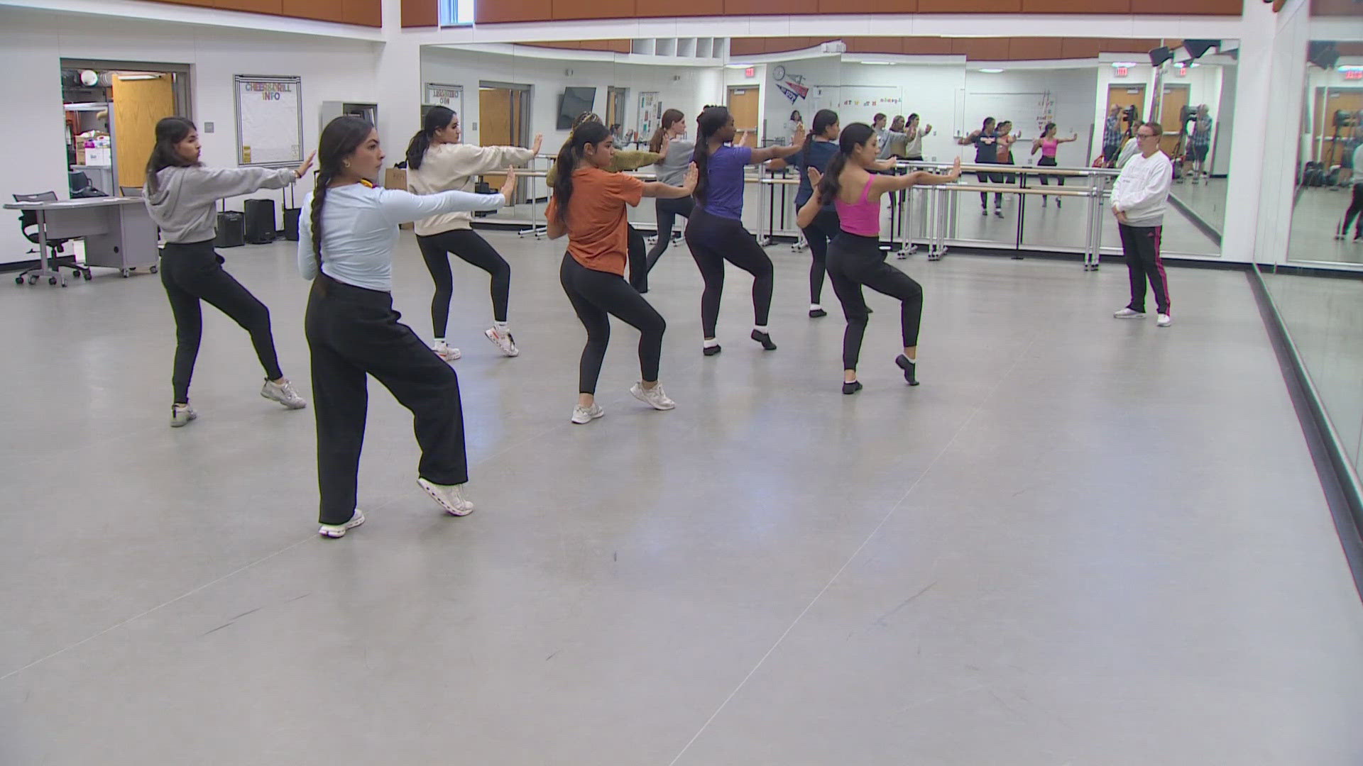 Members of the W.T. White High School dance team are part of a larger production that includes schools from across the country.