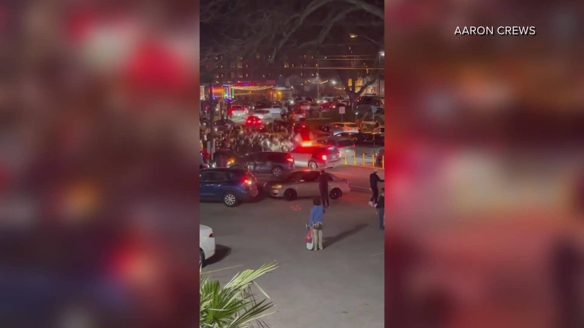 Witness video from Austin, Texas, showed crowds pushing back a police car and setting off fireworks.