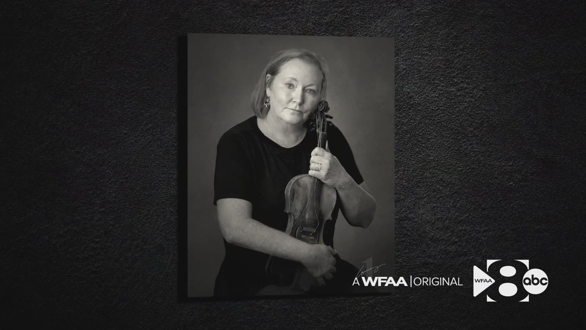 Larry Lourcey's subjects are photographed with the ONE item they would grab if their house caught on fire.