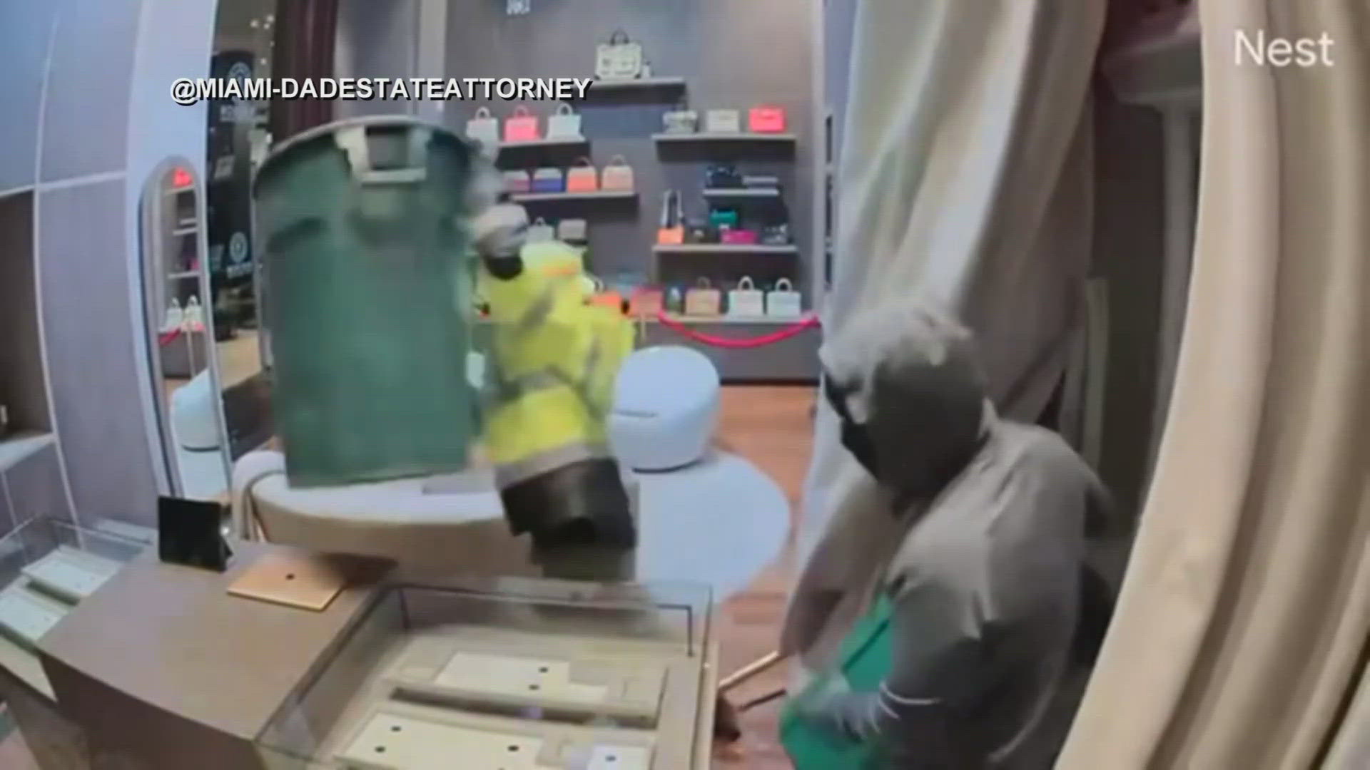Newly released surveillance video shows thieves break into a luxury store at a Miami hotel.