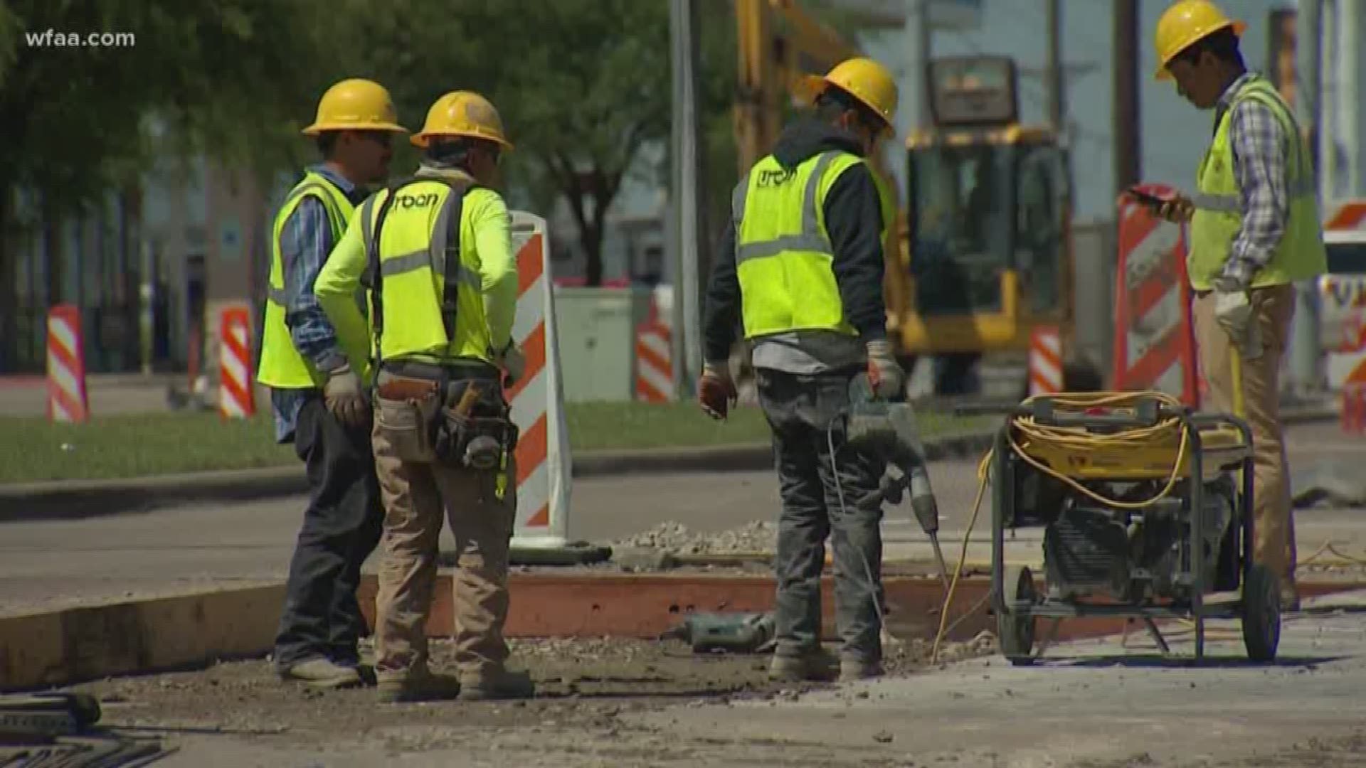 WFAA found crews across North Texas working in close contact with no protective gear.