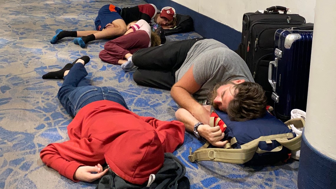 Father and 3 kids sleep on airport floor amid delays, cancellations
