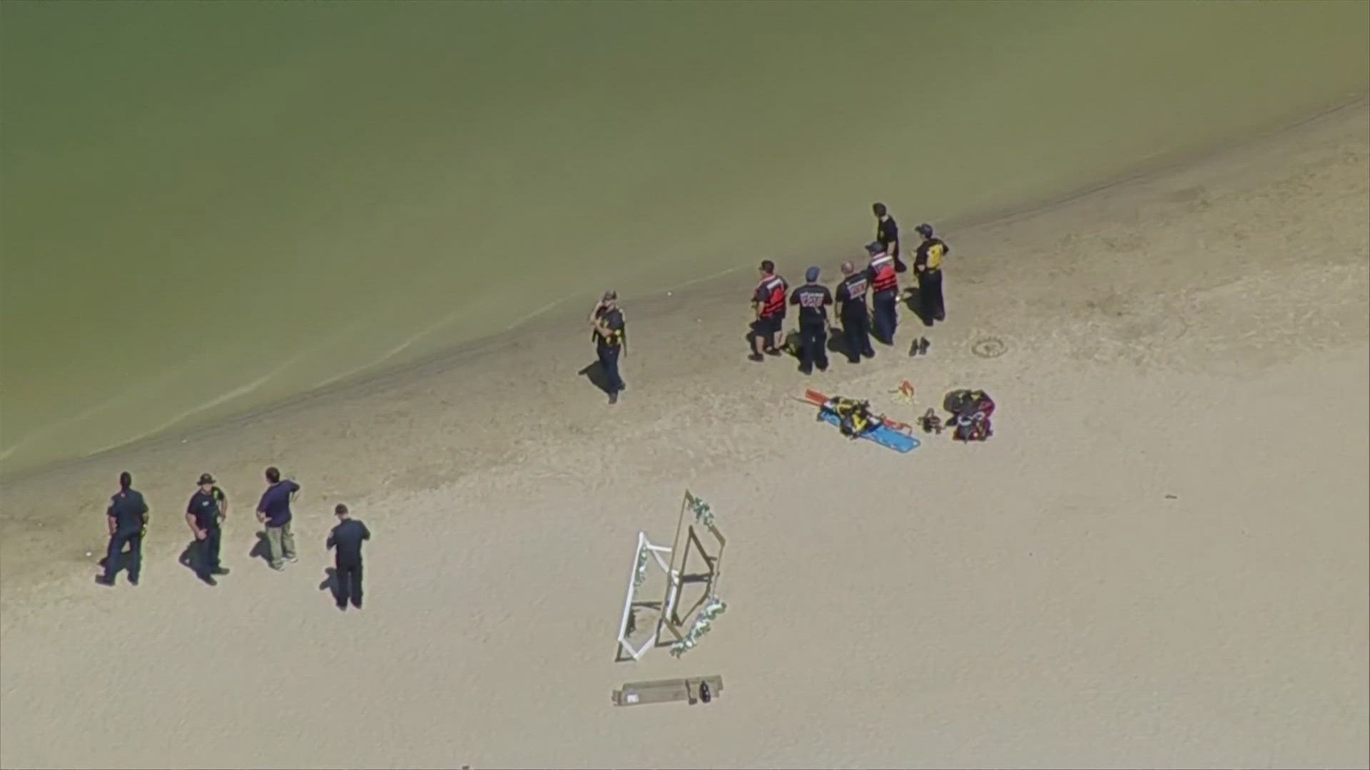 WFAA chopper footage showed boats searching the water Friday afternoon and a large presence at the lake.