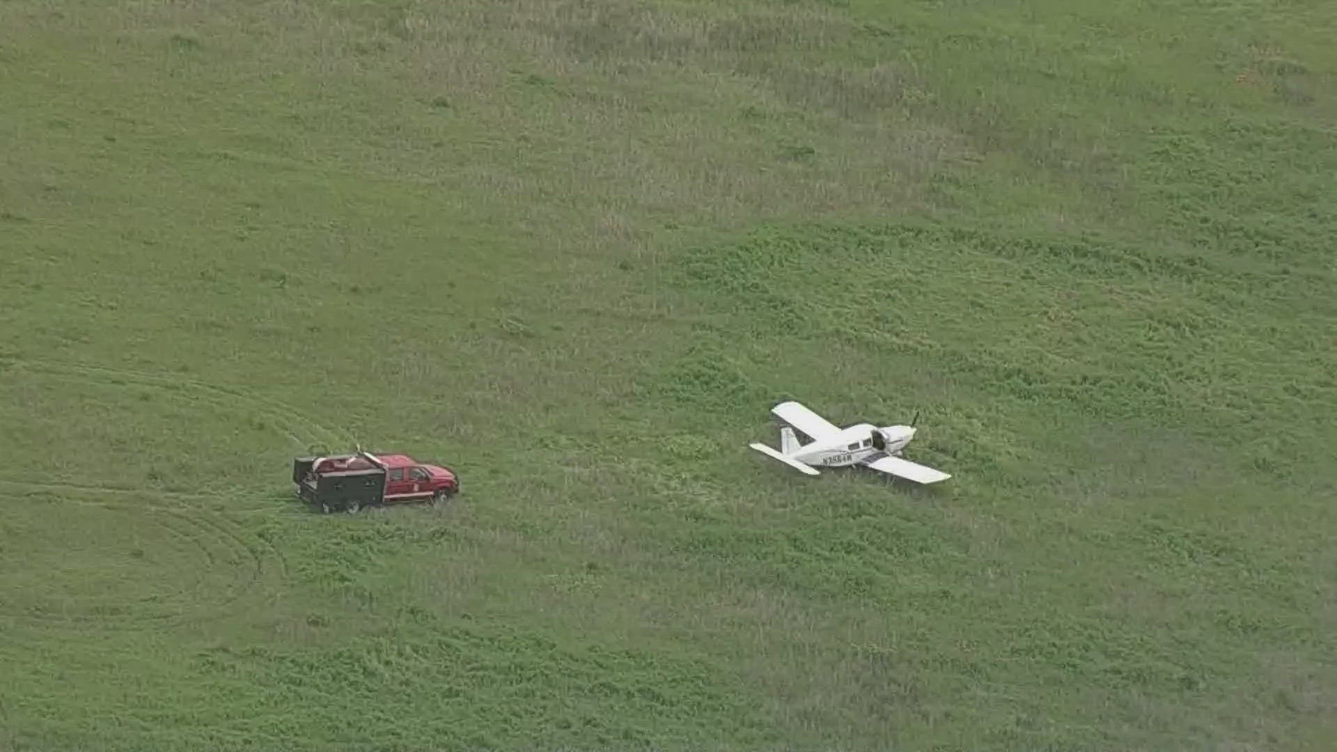 The Denton Fire Department said the crash happened in a field just north of Denton Enterprise Airport.