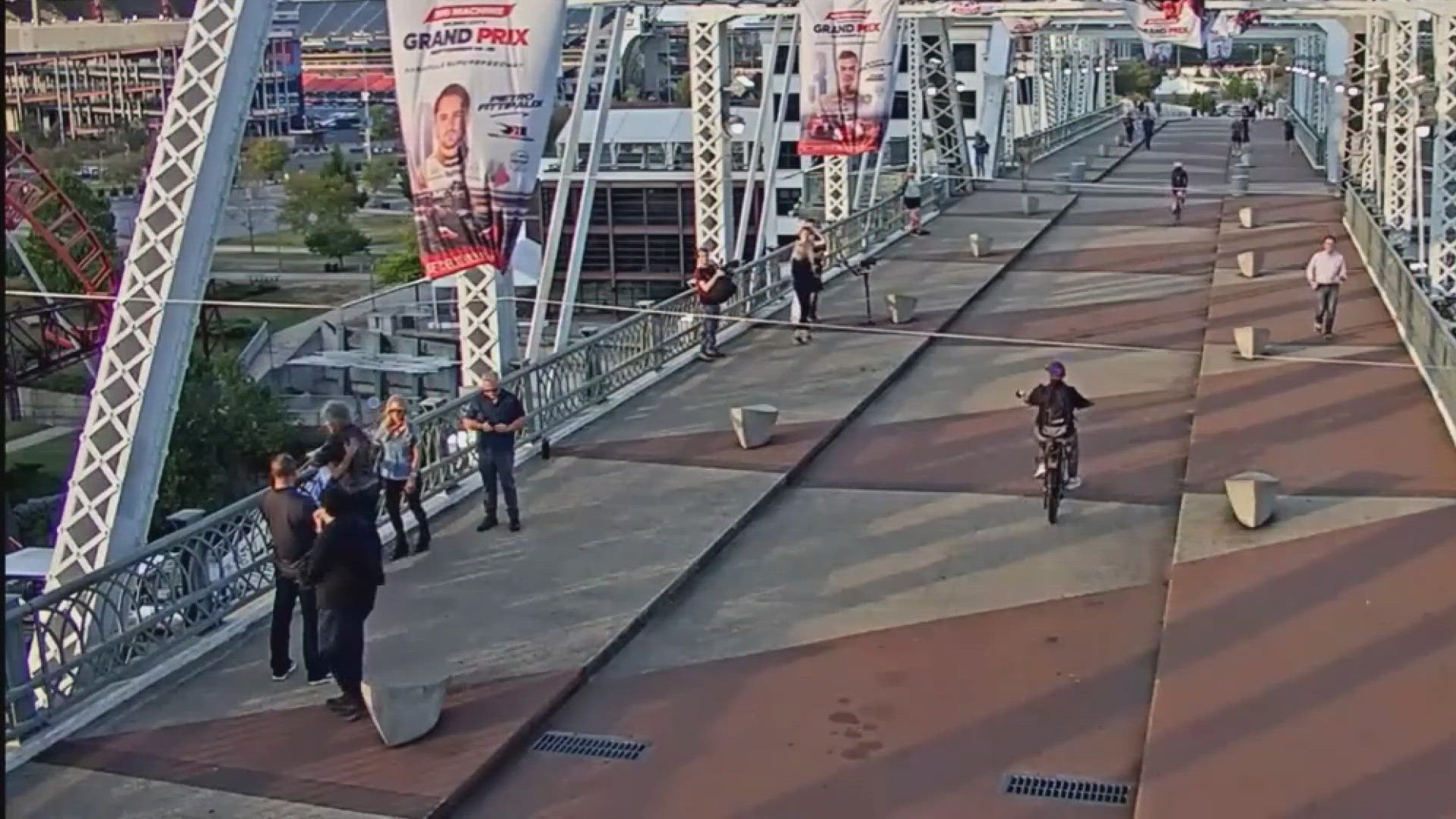 Famous singer Jon Bon Jovi was caught on camera talking a woman down from the ledge of a Nashville pedestrian bridge.