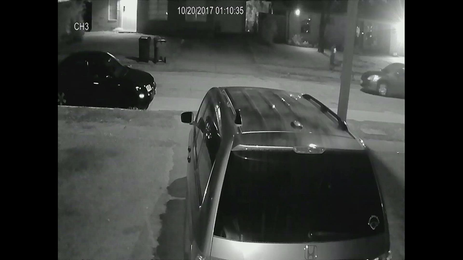Officials said detective recovered surveillance video from a residence that showed two men and a small four-door passenger car near the murder scene.