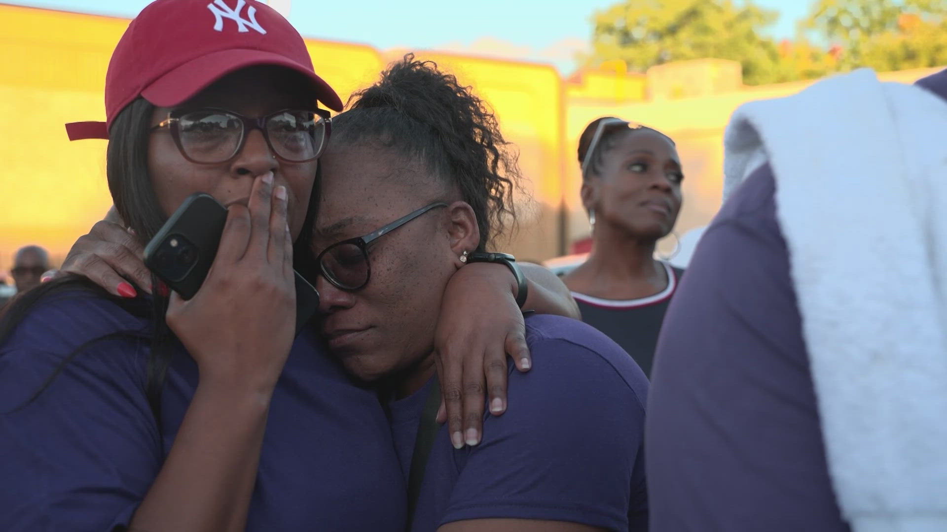 Dallas Police Officer Darron Burks was killed in his squad car overnight. The day after his murder, dozens gathered to honor his life.