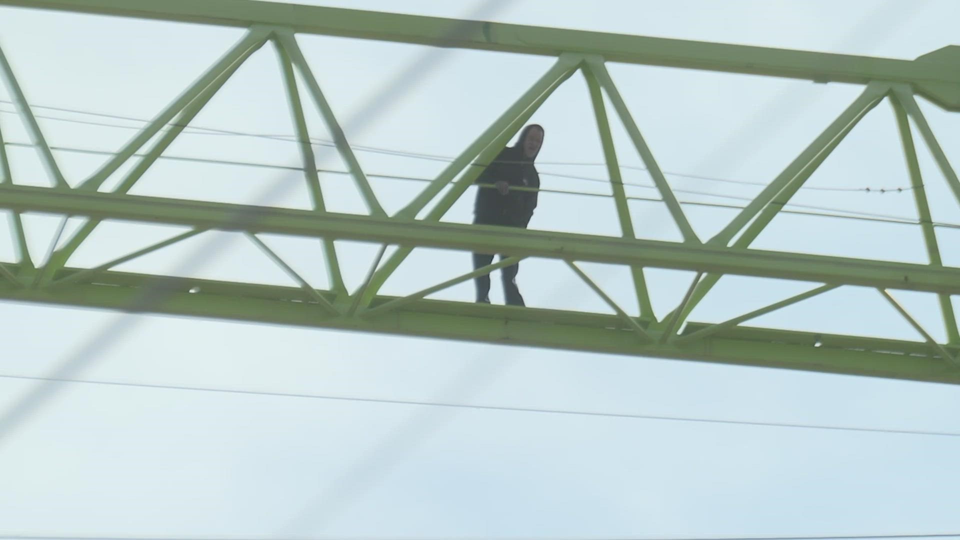 Police had a street blocked in West Dallas for hours after a man was spotted on a construction site crane.