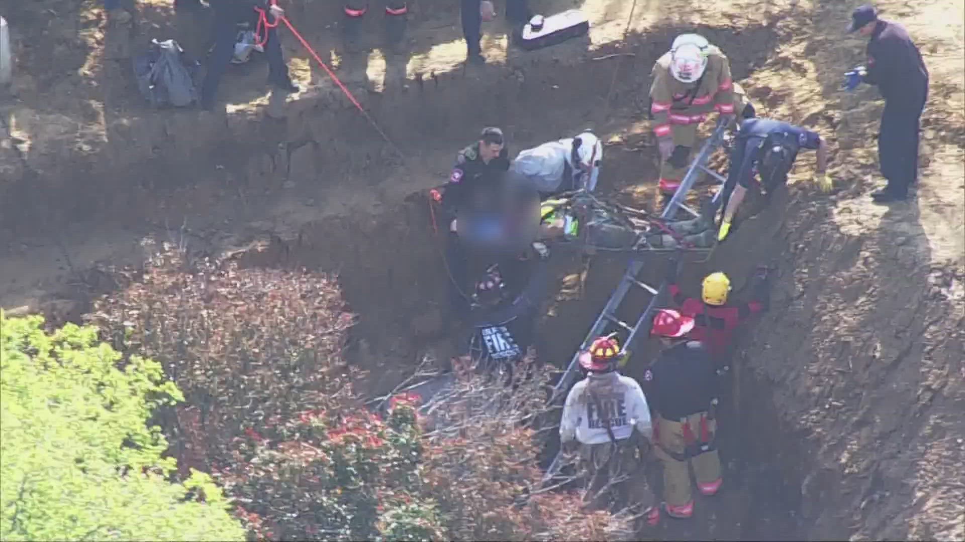 The department told WFAA that a man was inside a pipe that washed away.