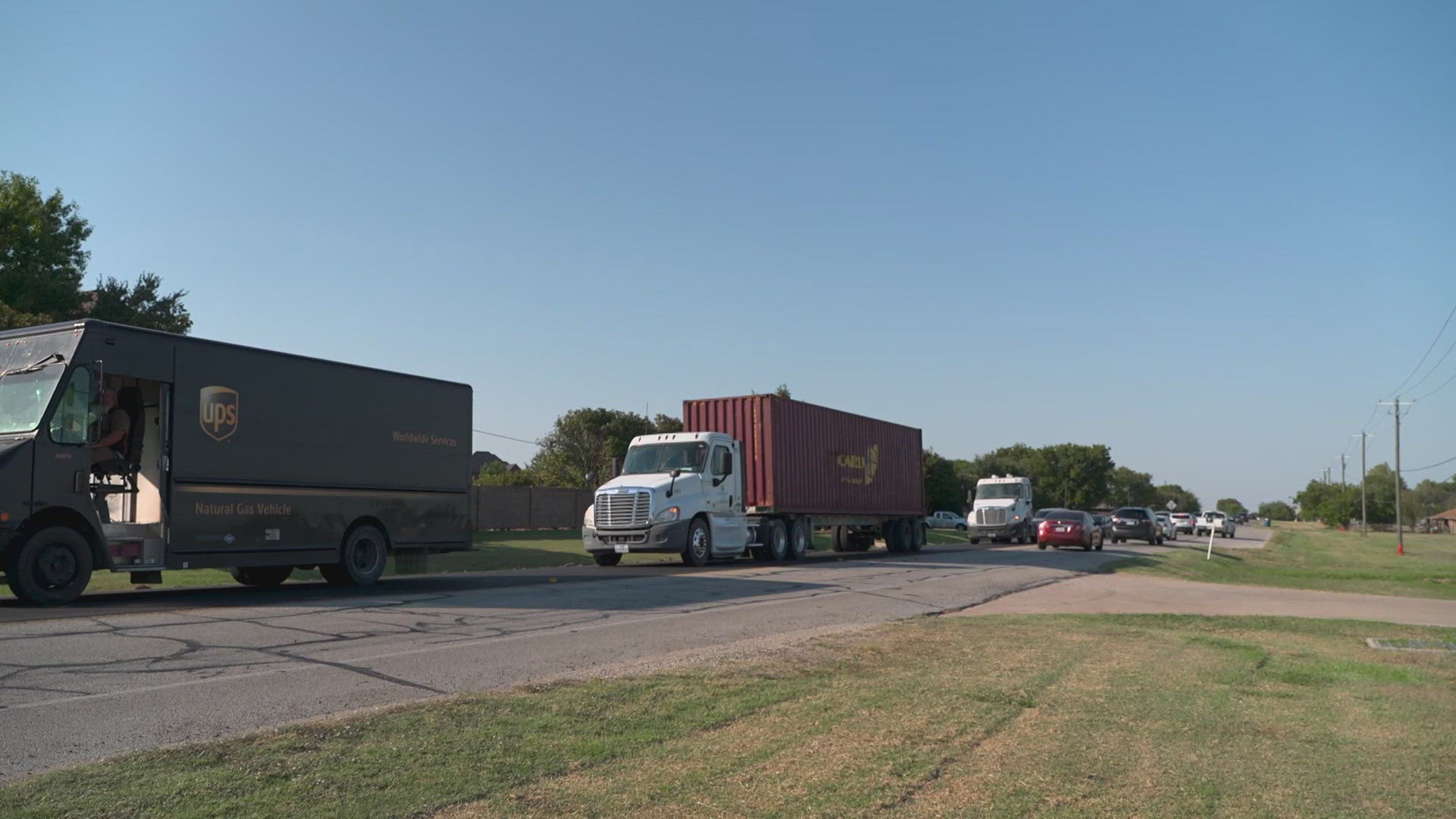 Traffic stops and go in the main road connecting Halset to the rest of the Metroplex.