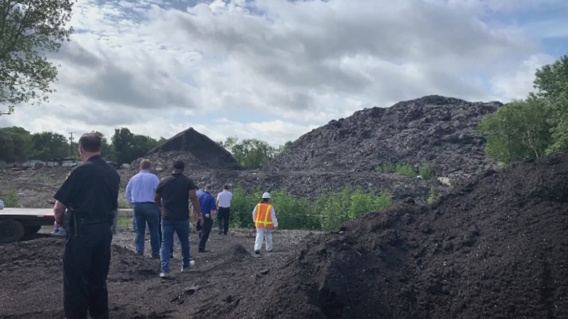 It took a trucking crew about a month and a half to remove a 150,000-ton mound of recycled shingles. Neighbors in Floral Farms said they're now breathing easier.