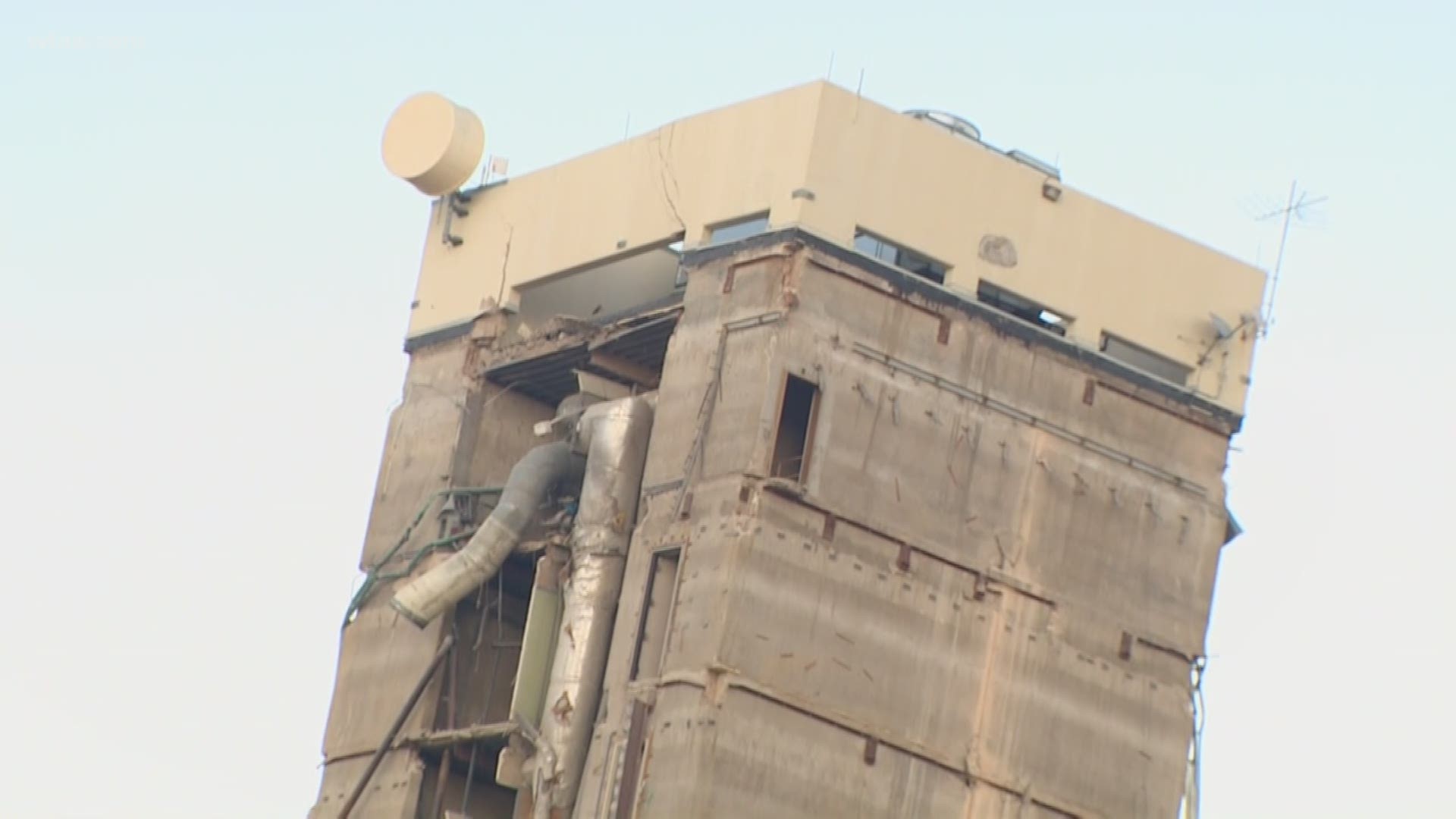 The implosion began at 7:45 a.m. but the tower still hadn't come down as of Sunday evening.