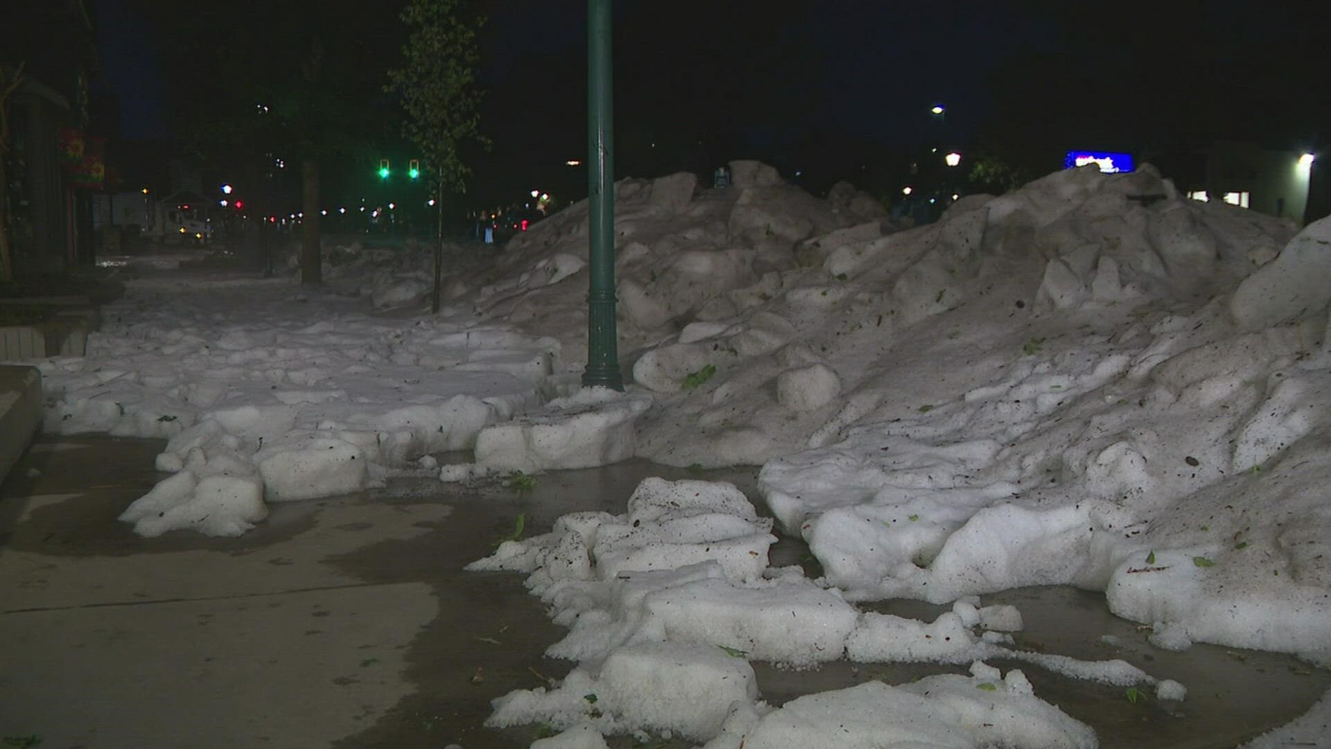 Crews in Estes Park, Colorado had to use heavy equipment to clear the roads after a large hail storm.