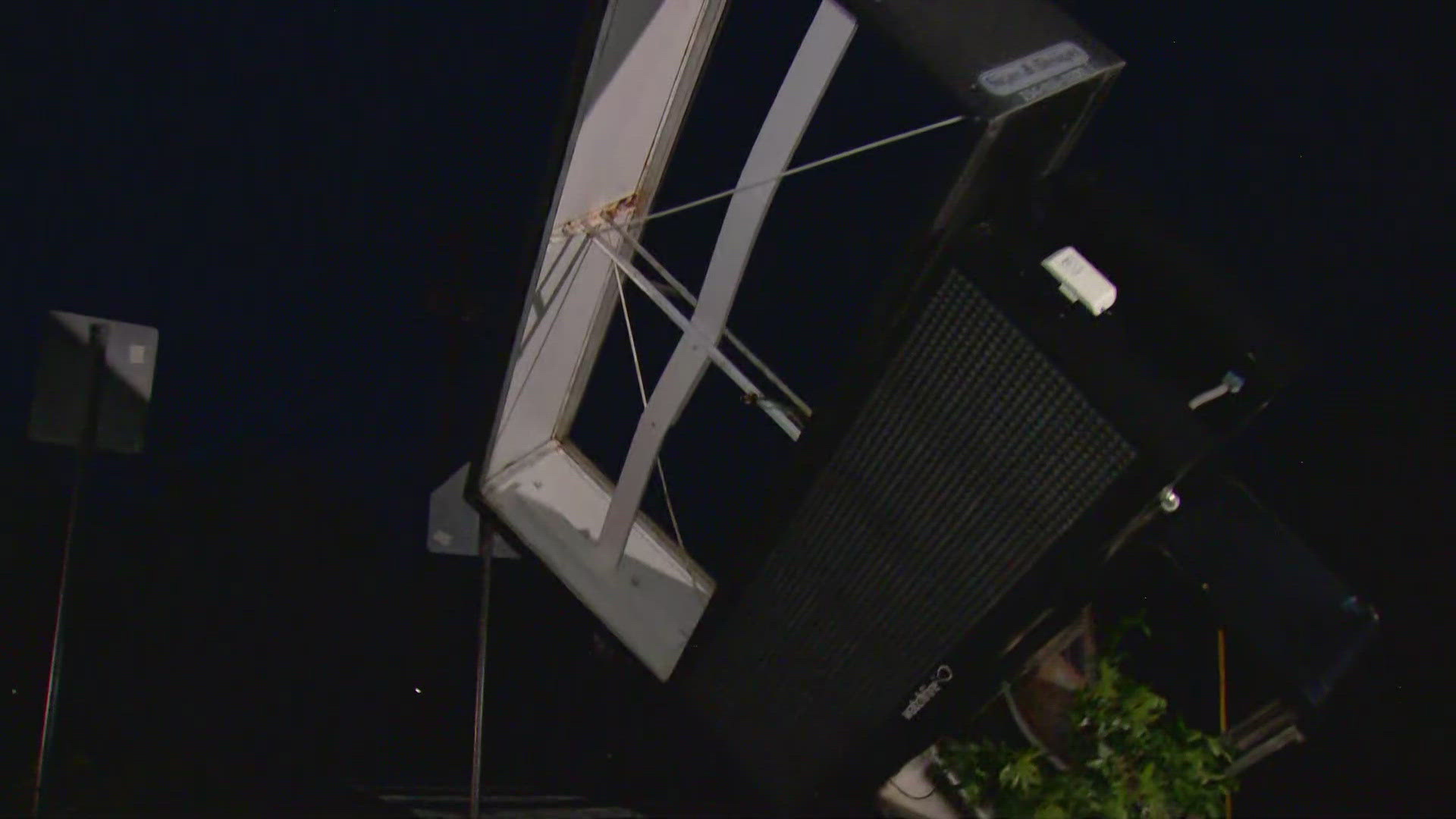 Signs were toppled and buildings were destroyed in the storm.