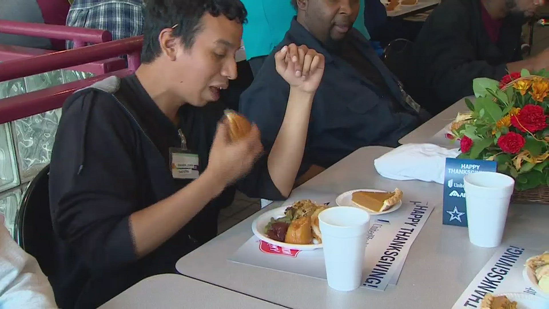 The Dallas Cowboys serve an early Thanksgiving meal at Salvation Army 