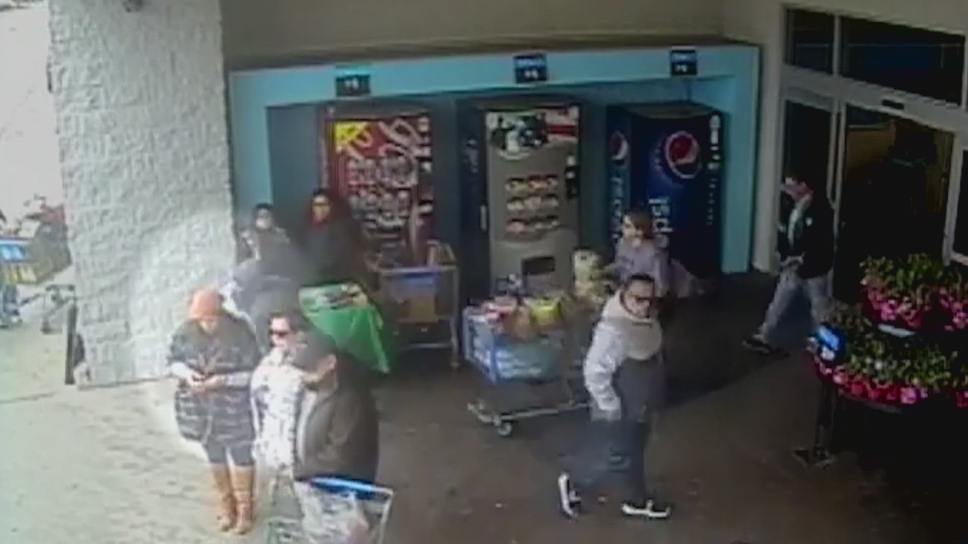 Surveillance video shows a suspect walk past a Girl Scout cookie stand, reach behind a table, take a bag containing cash, and then run into the parking lot.