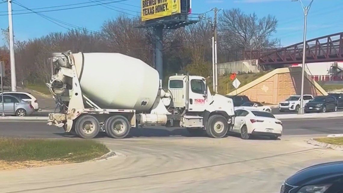 A cement mixer ramming and dragging a car? Another day at this East