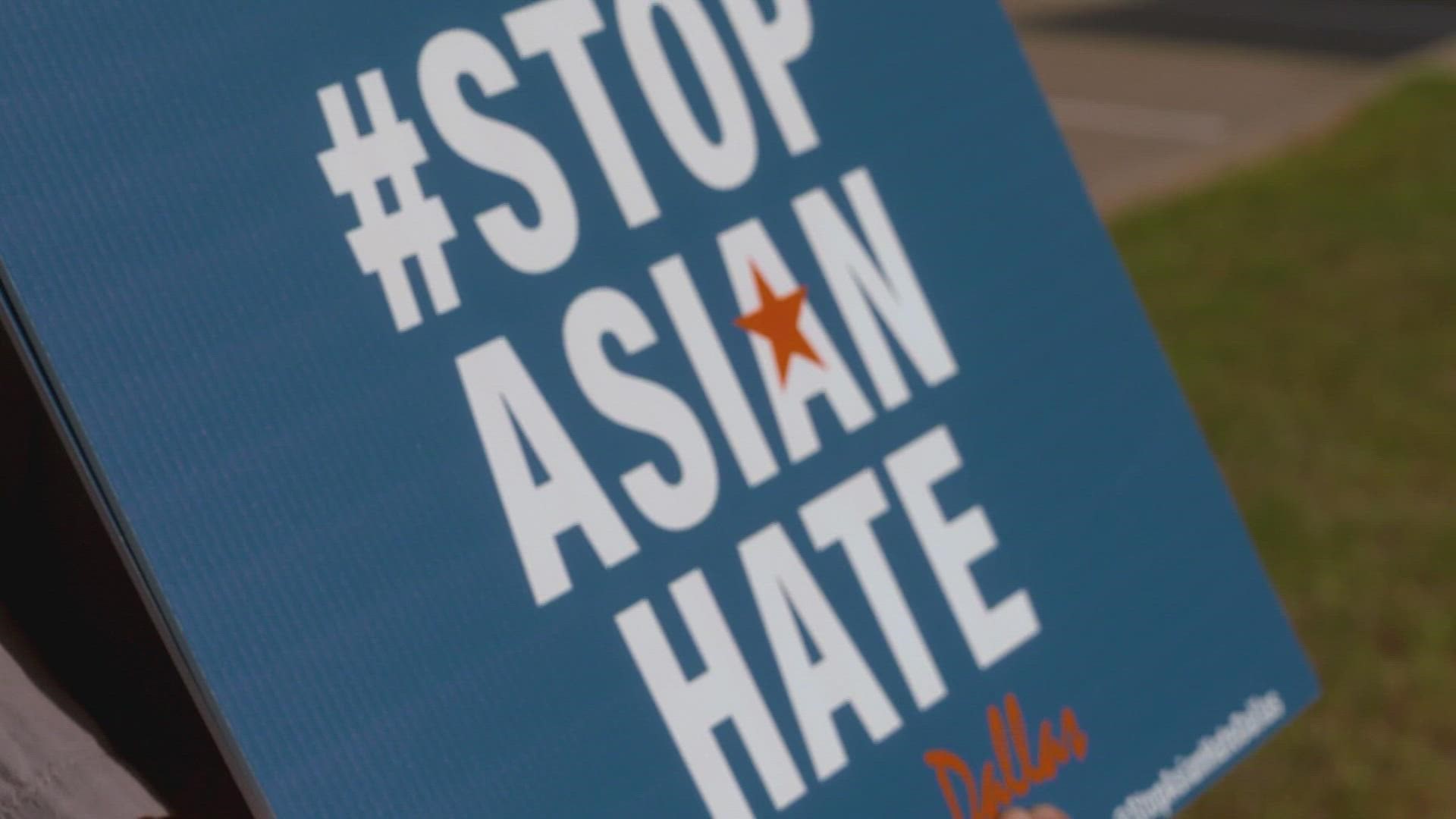 Jonas Park stood outside the shops in Koreatown in Dallas holding a sign that reads, "Stop Asian Hate."