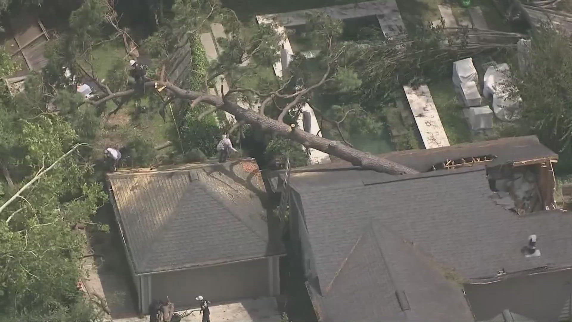 The hurricane tore through Houston, leaving behind fallen trees and parts of the roof of NRG Stadium ripped off from the winds.