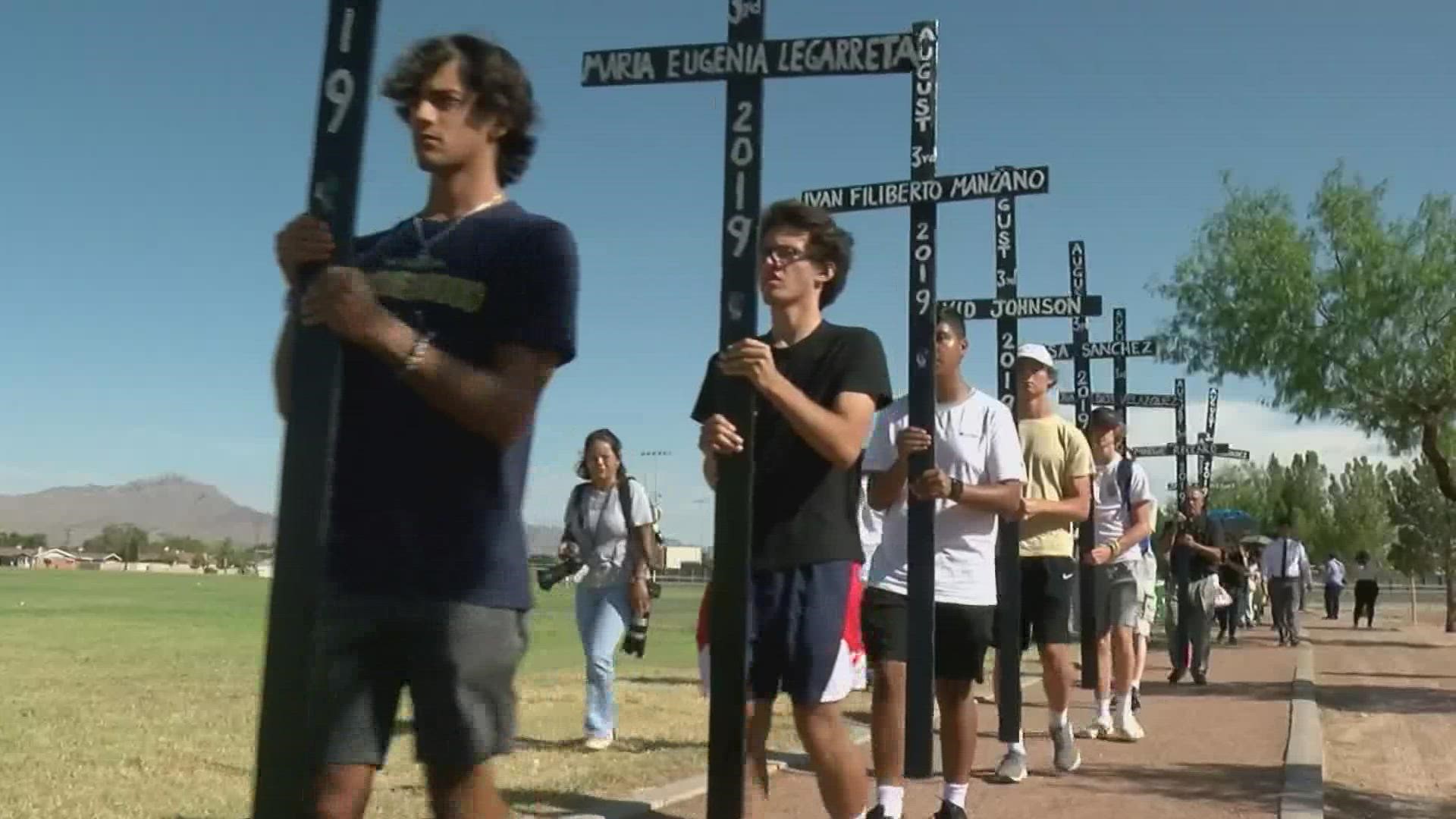 Residents marched with crosses that had the names of victims as Aug. 3, 2022, marked three years since the deadly shooting at an El Paso Walmart.