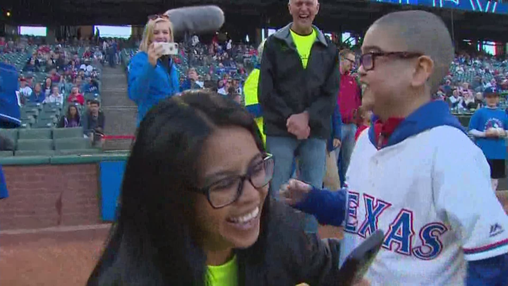 DeSoto boy waiting for heart transplant charms the Ranger's crowd with two 'first' pitches