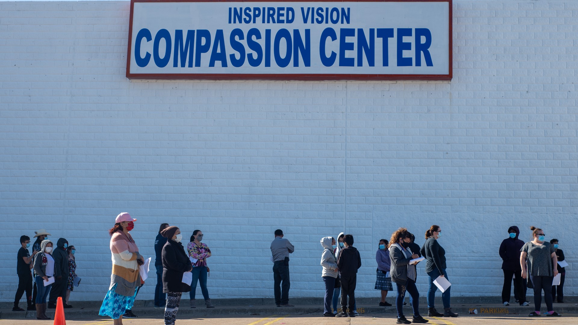 Hundreds of families line up at Inspired Vision Compassion Center every weekday for food and other resources.