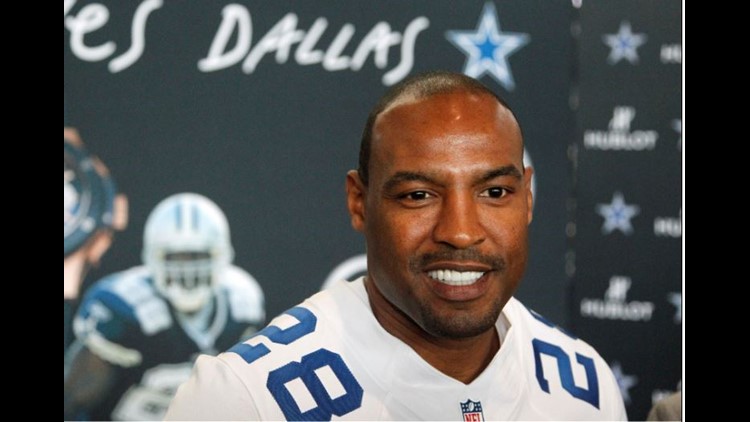 Darren Woodson of the Dallas Cowboys walking on the field during a