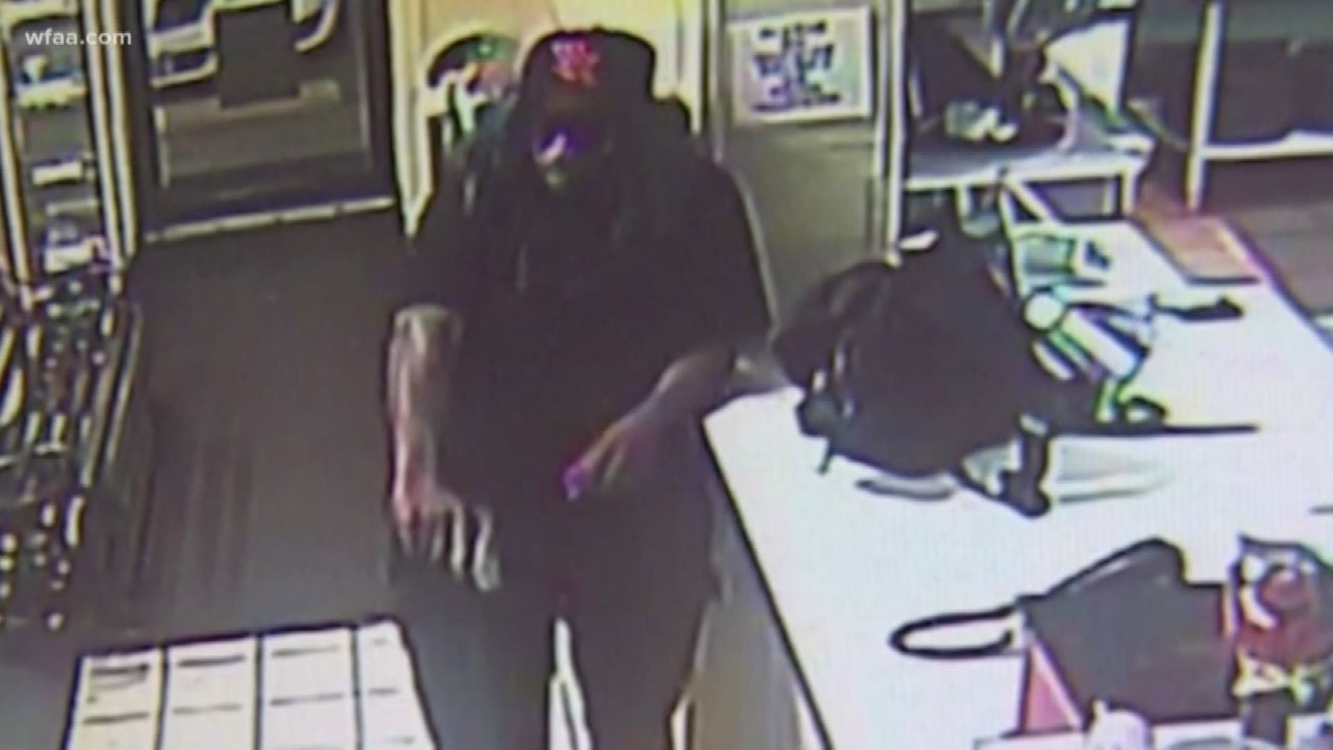 Video captured images of an armed man wearing a wig with a hat attached as he robbed a pizza restaurant. Now there's a concern he's linked to other crimes.