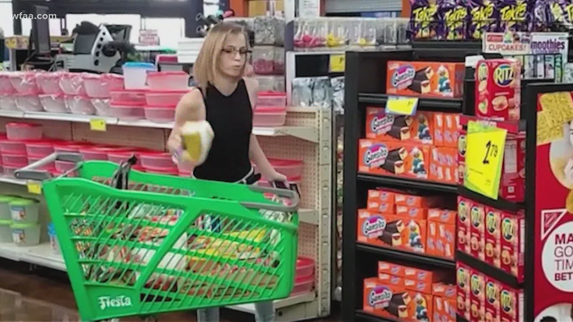 The unidentified woman shouts profanities and tosses food from her shopping cart over being asked to wear a mask in a Fiesta grocery store.