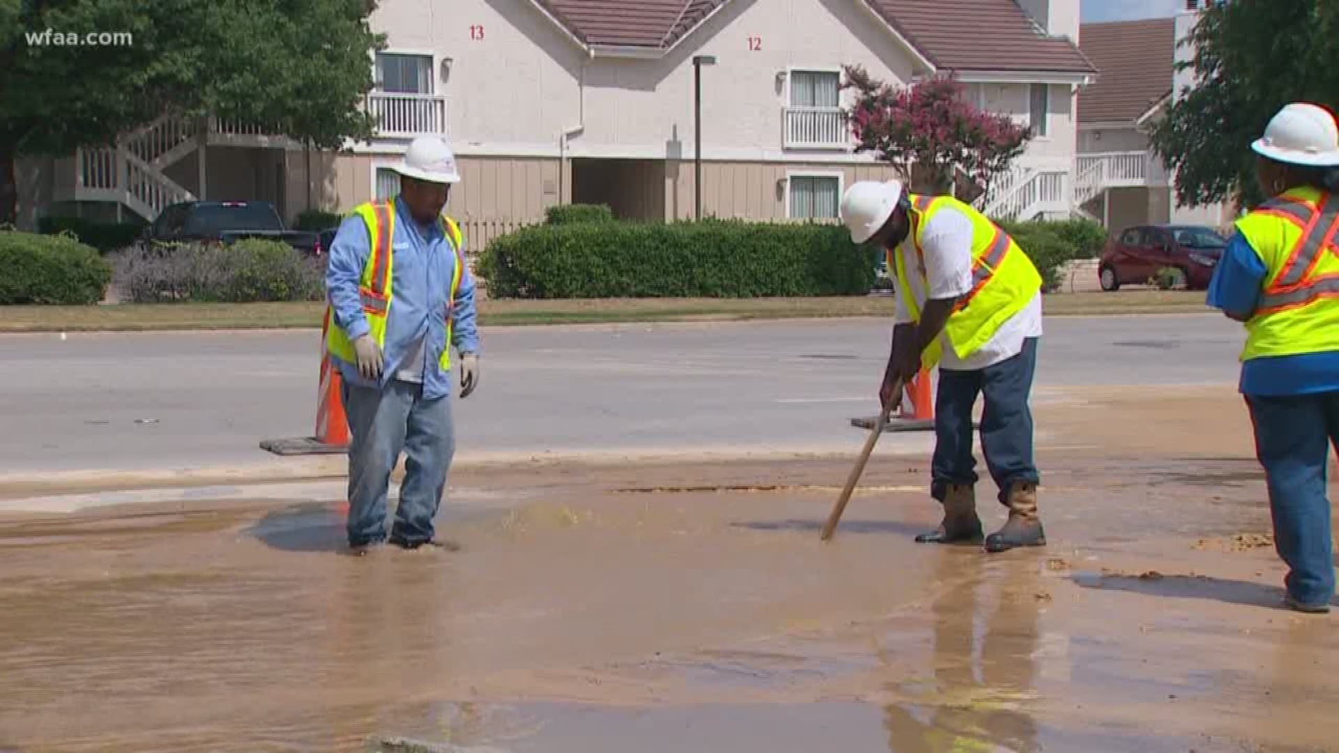 A large sink hole formed on University Drive in Fort Worth after a water main break Sunday. Todd Unger reports.