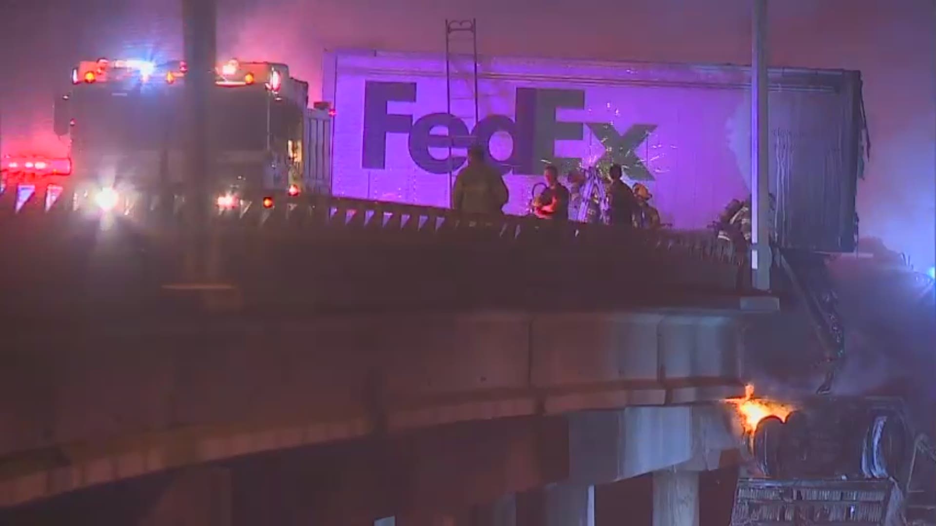 The driver's truck plunged off a bridge and caught fire, police said.