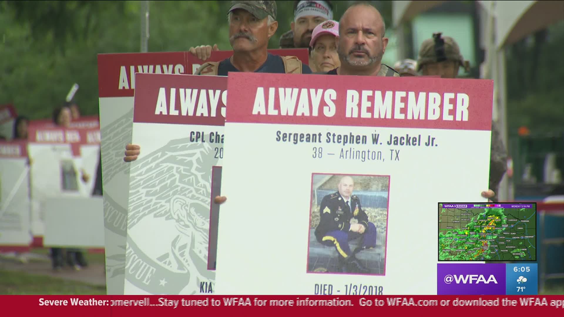 White poster boards with pictures of fallen heroes were put up along the Katy Trail. On Memorial Day, they were brought to Reverchon Park in a powerful procession.