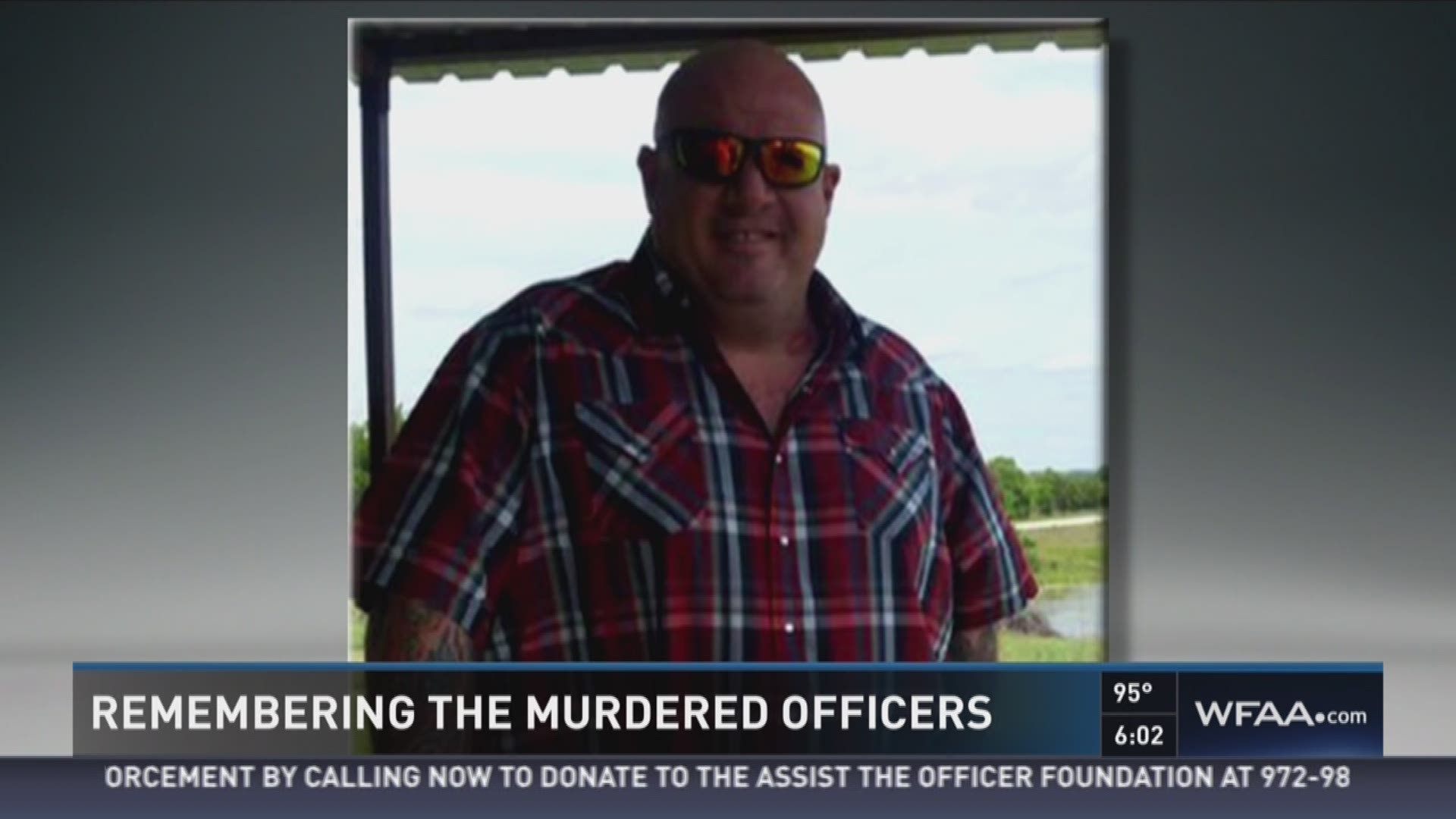 Tanya Eiserer speaks with the friends of Lorne Ahrens, one of the five officers killed in an ambush Thursday night.