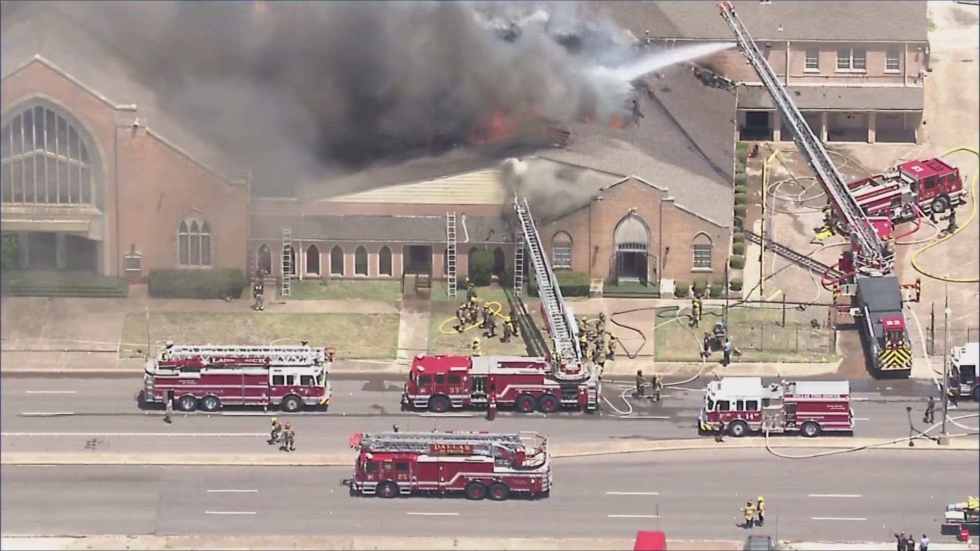 Dallas firefighters are working to put out hot spots during the hottest day of the year so far.