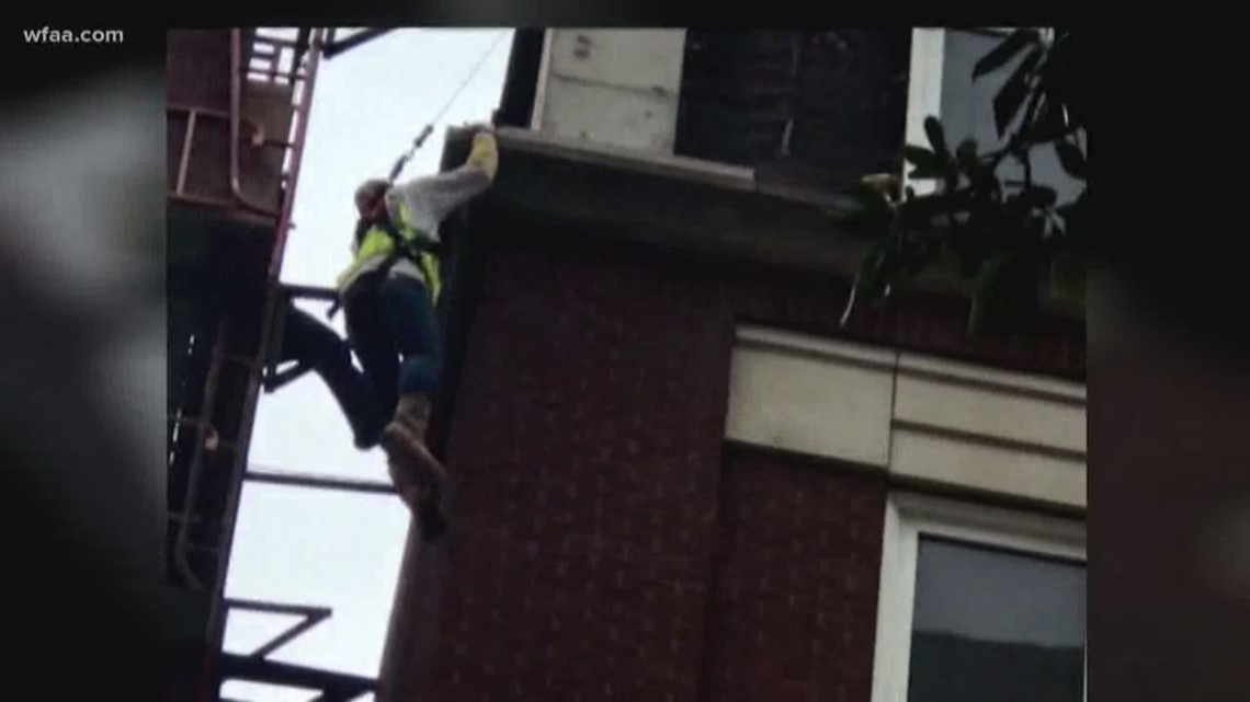 Scaffolding collapses, leaving worker dangling from 
