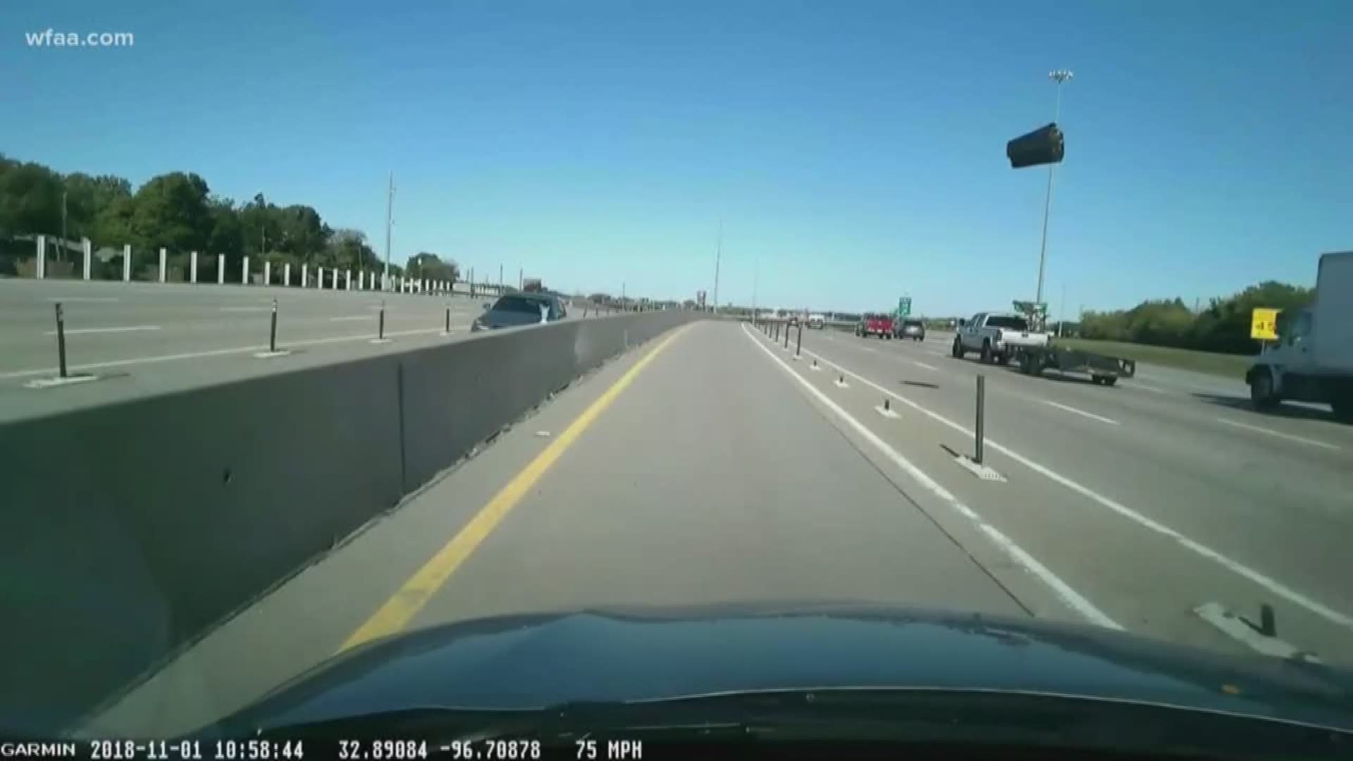 Incoming! Video shows trashcan soaring across 3 lanes and hitting woman's windshield