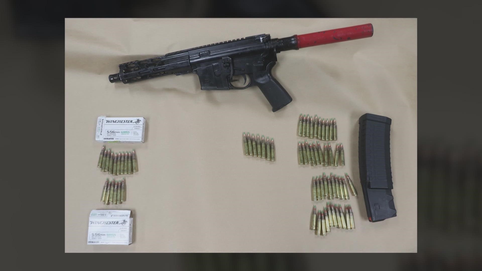 Authorities said they found a modified AR-15 pistol and a 60-round magazine. Dozens of armor-piercing rounds were also confiscated.